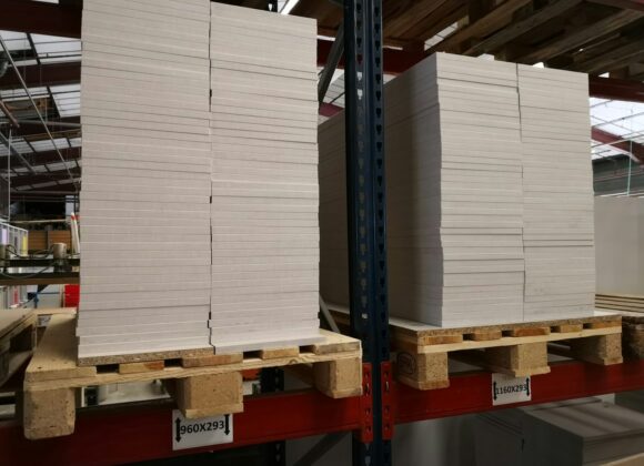 stack of wooden planks on brates