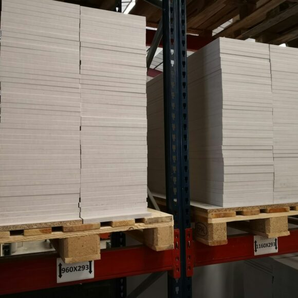 stack of wooden planks on brates